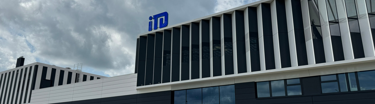 iTD headquarters building facade with logo