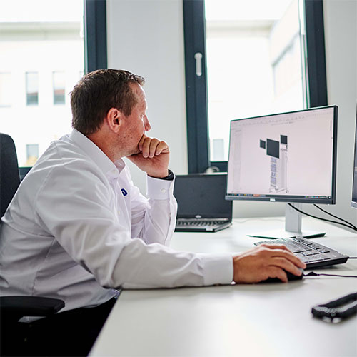 Employee sitting infront of a computer